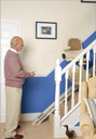 A stairlift going up a staircase